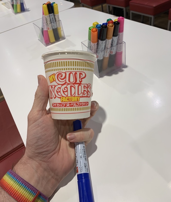 cup noodle and pens
